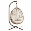 Fauteuil suspendu Polvaken en métal et résine tressée beige et marron avec support, dimensions 110x110x195 cm.