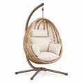Fauteuil suspendu en rotin naturel et acier marron, style bohème, dimensions 105x105x195 cm avec support, par Polvaken